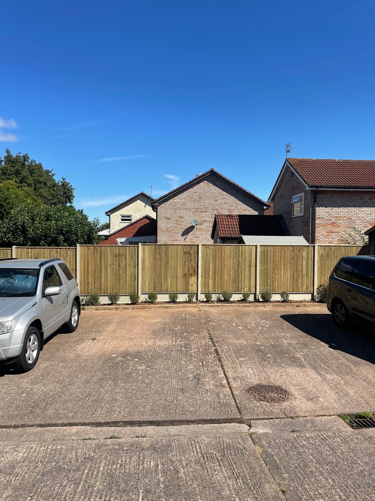 New closeboard fencing across the end of a shared driveway